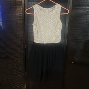 Sleeveless black and white sparkle dress